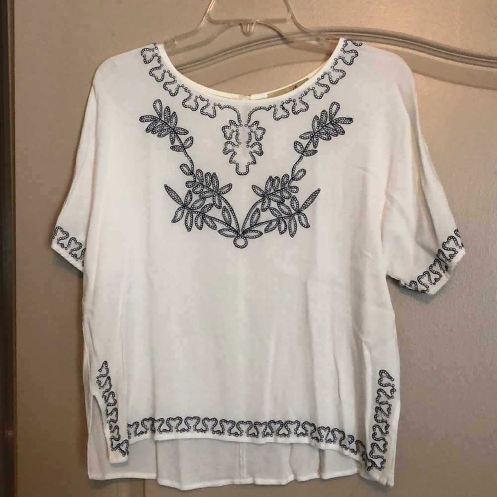 White and blue embroidered top